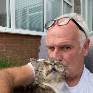 Weekly Lottery prize winner, Chris McNab and his cat Mr T