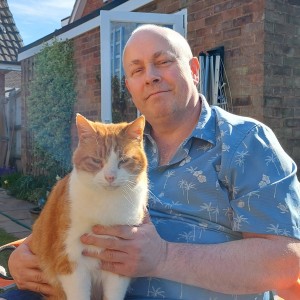 Weekly Lottery winner Nigel with his cat Harvey